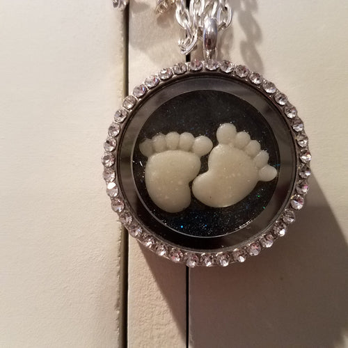 Open locket with breastmilk charm